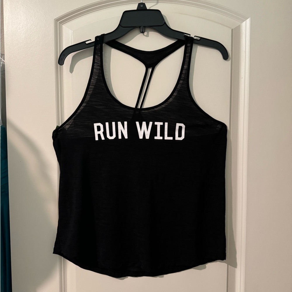 Stretchy breathable black tank top
Size medium